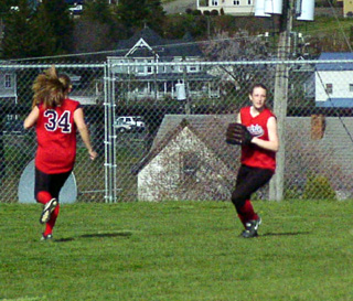 Kylie Uhlorn gets ready to throw back to the infield after catching a long fly ball.