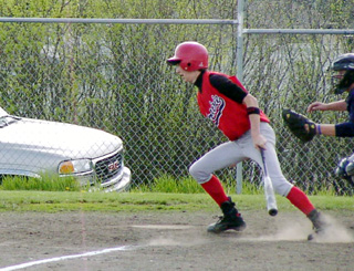Nate Kaschmitter heads for first after his first of 4 hits in the Lewis County game.