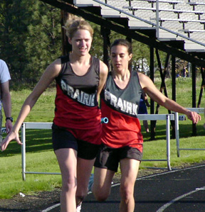 Sienna Benton hands off to Katie Nuxoll in the 4x200 relay.