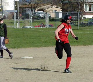 Tiffany Schaeffer heads for third after hitting a bases loaded triple.