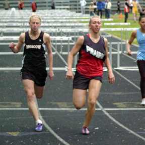 Tabitha Sonnen finishes first in the 100 hurdles.