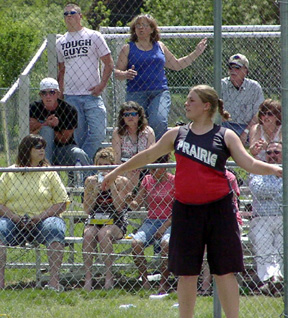 Charlene Duman watches her discus throw. She advanced to state in both the discus and shot put with personal bests in both events.