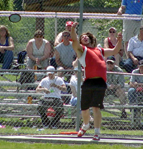 J.D. Riener makes the winning toss in the discus. He also won the shot put and will defend his state titles in both events.