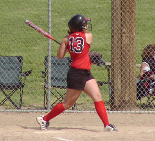 Brooke Holthaus swings against Rimrock. She had 6 hits at state, 4 in the championship game.