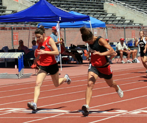 Nicole Nida gets the lean to win the 400 meter dash.