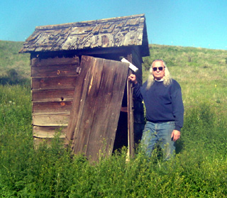 Author Michael Lamping near an old shed in the Craig Mountain area his stories are based in.