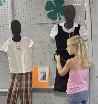 This young lady straightens up an exhibit.