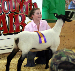 Ally Cook with her grand champion lamb