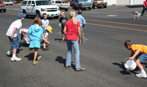 Youngsters came prepared with bags and buckets for the candy tossed by parade entrants.