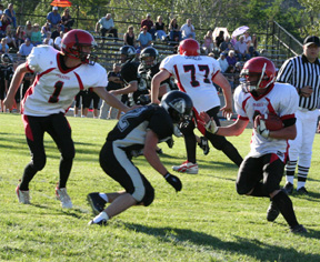 Branden Waller makes a cut to get past the defender. At left is DavidSigler while in the background is Ronnie Chandler, 77.