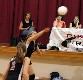 Chantel Boniecki spikes the ball against Nezperce. #2 is Kim Schaeffer.