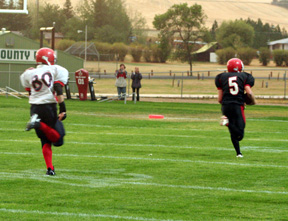 Kyle Daly pulls away from the defenders for a 60-yard touchdown run.