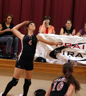 Samantha Frei winds up for a spike. At right is Tiffany Schaeffer.