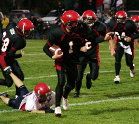 David Sigler steps out of a tackle for a big gain.