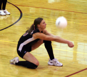 Tiffany Schaeffer digs up a serve.