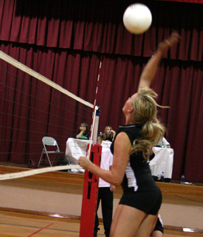 Chelsey Long spikes the ball against Timberline.