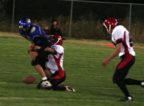 Kyle Daly sacks the Genesee quarterback and forces a fumble.