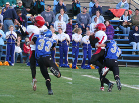 Pass interference maybe? Despite getting hit before the ball gets there, David Sigler made the catch anyway (right-hand picture).