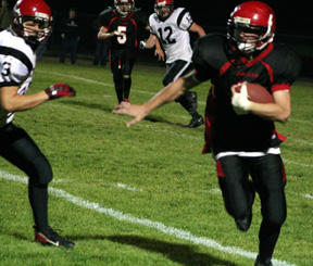 Branden Waller gains yardage on a running play.