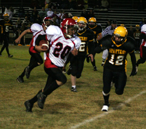 Tyrell Langston gains big yardage near the end of the first half.