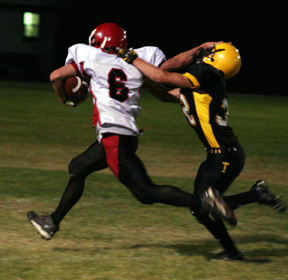 Branden Waller wards off a Timberline defender on a long pass play.