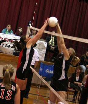 Tiffany Schaeffer and a Kendrick player joust at the net.