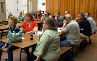 Prairie teachers listen attentively.