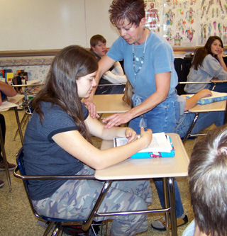 Pollyanna Candalot uses Gina Seubert during a presentation on massage for the sophomore health class at PHS.