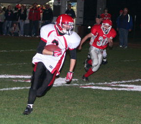 Conner Rieman heads for the end zone after catching a pass.