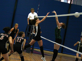 Tiffany Schaeffer gets a spike past the blocker. Also shown from left are Kaylee Uhlenkott, Chelsea Long and Alli Holthaus.