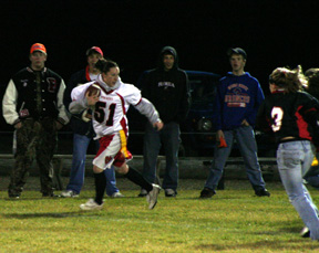 Kaylee Uhlenkott runs along the sideline for the junior-sophomore team.