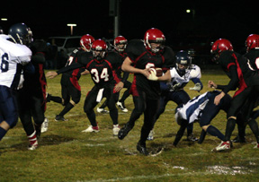 Branden Waller splashes through a huge hole opened by the Prairie line. He wound up scoring on this play.