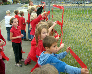 Another photo of putting up the ribbons.