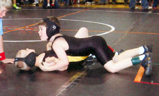Rafe Coates wrestled his way to a gold medal. Here he is about to pin his opponent.