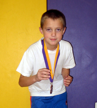 Dally Ratcliff shows off his first ever medal.