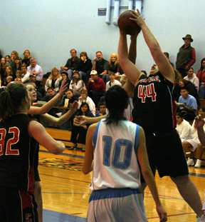 Hilaree VanderPas grabs a rebound after a missed free throw.