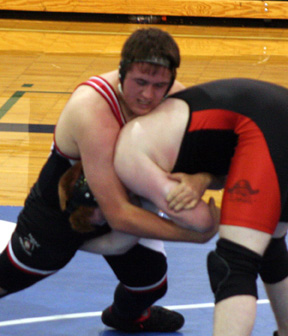 Chance Ratcliff tires to take down a Pomeroy opponent.