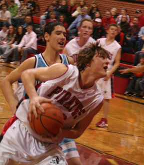 Branden Waller drives past a Lapwai defender for a lay-up.
