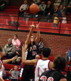 Devin Schmidt gets off a winde open shot against Council.