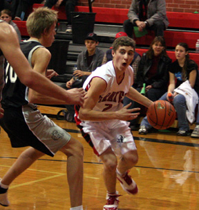 Eric Daly drives toward the hoop.