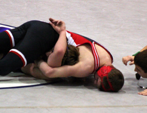 Jake Wimer pins his opponent.