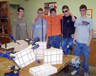 Mike Mattson, Ronald George, Wyatt Williams, Jake Wimer and Eric Daly after gluing and clamping shadow-boxes.