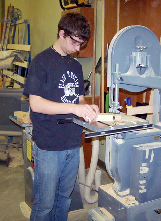 Tyler Rogers cutting out Pirate ship parts.