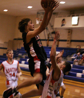 Branden Waller goes high for a shot.