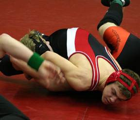 Jake Wimer goes for a pin in his first round match.