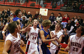 Everyone looks up as Tyler Forsmann's shot bounces on the rim. From left are Kenneth Enneking, Forsmann, Eric Daly and David Sigler.