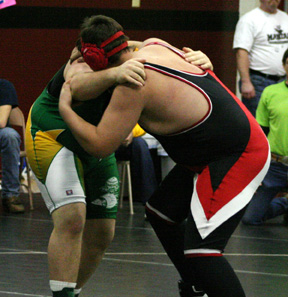 Mitchel Jungert grapples with a Potlatch wrestler.