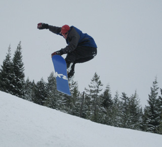Ronald George makes a jump on his skiboard.