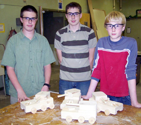 In this photo are Garrett Workman, DJ Walker and Silas Whitley with their toys tanks.