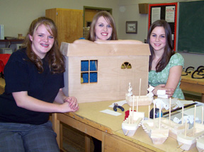 This photo shows Sheri Schumacher, Kayla Johnson and Haleigh Schmidt with their Doll houses.